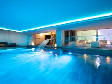 a pool with a waterfall