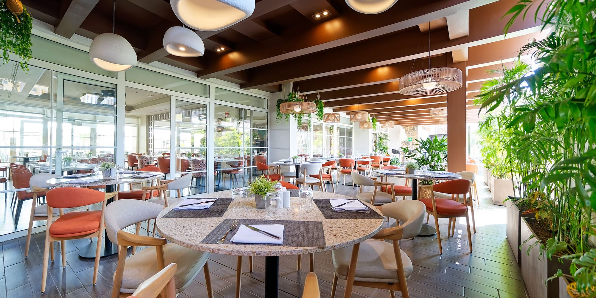 a restaurant with tables and chairs