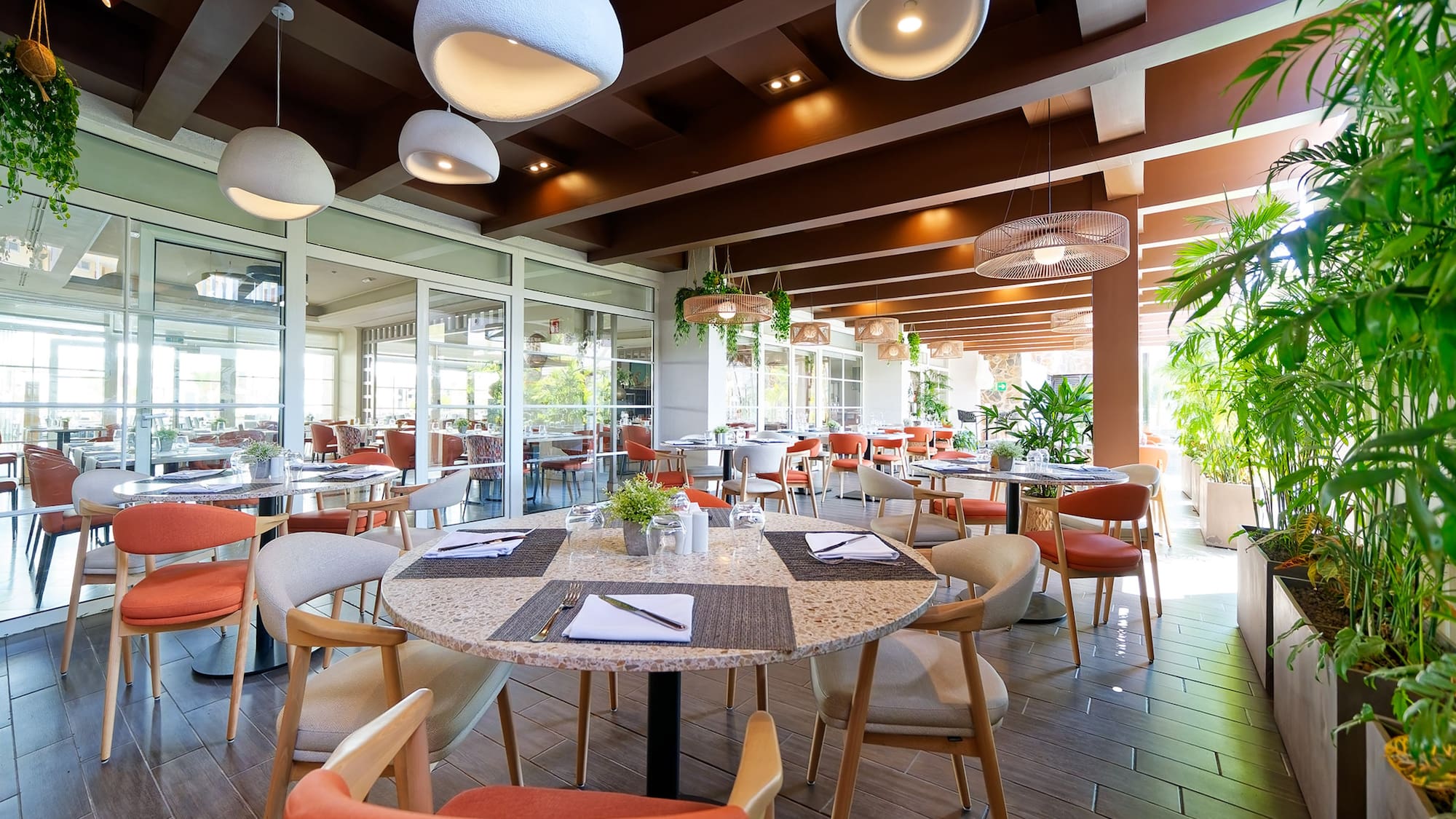 a restaurant with tables and chairs