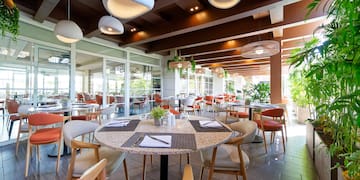 a restaurant with tables and chairs