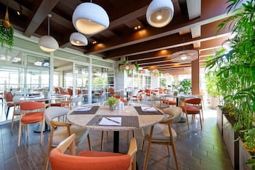 a restaurant with tables and chairs