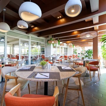 a restaurant with tables and chairs