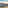 Puerto Banús marina with yachts, white town, and La Concha mountain at sunset.