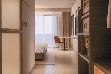 a room with a bed and a table