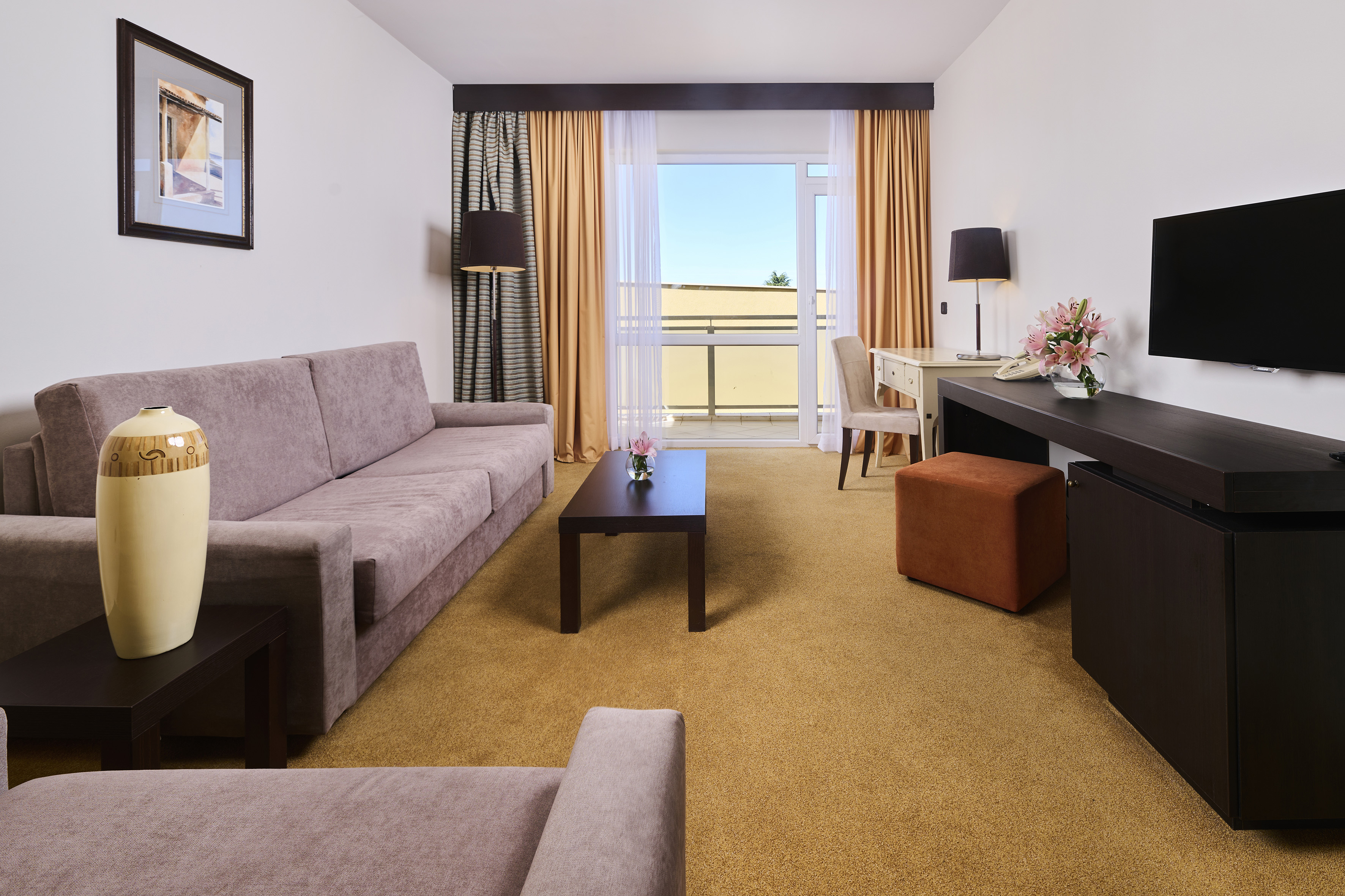 a room with a couch and a desk