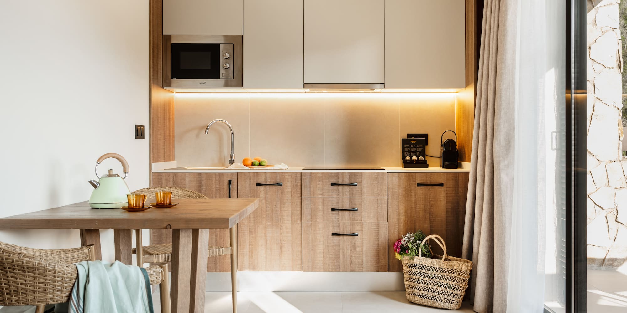 a kitchen with a table and a basket.
