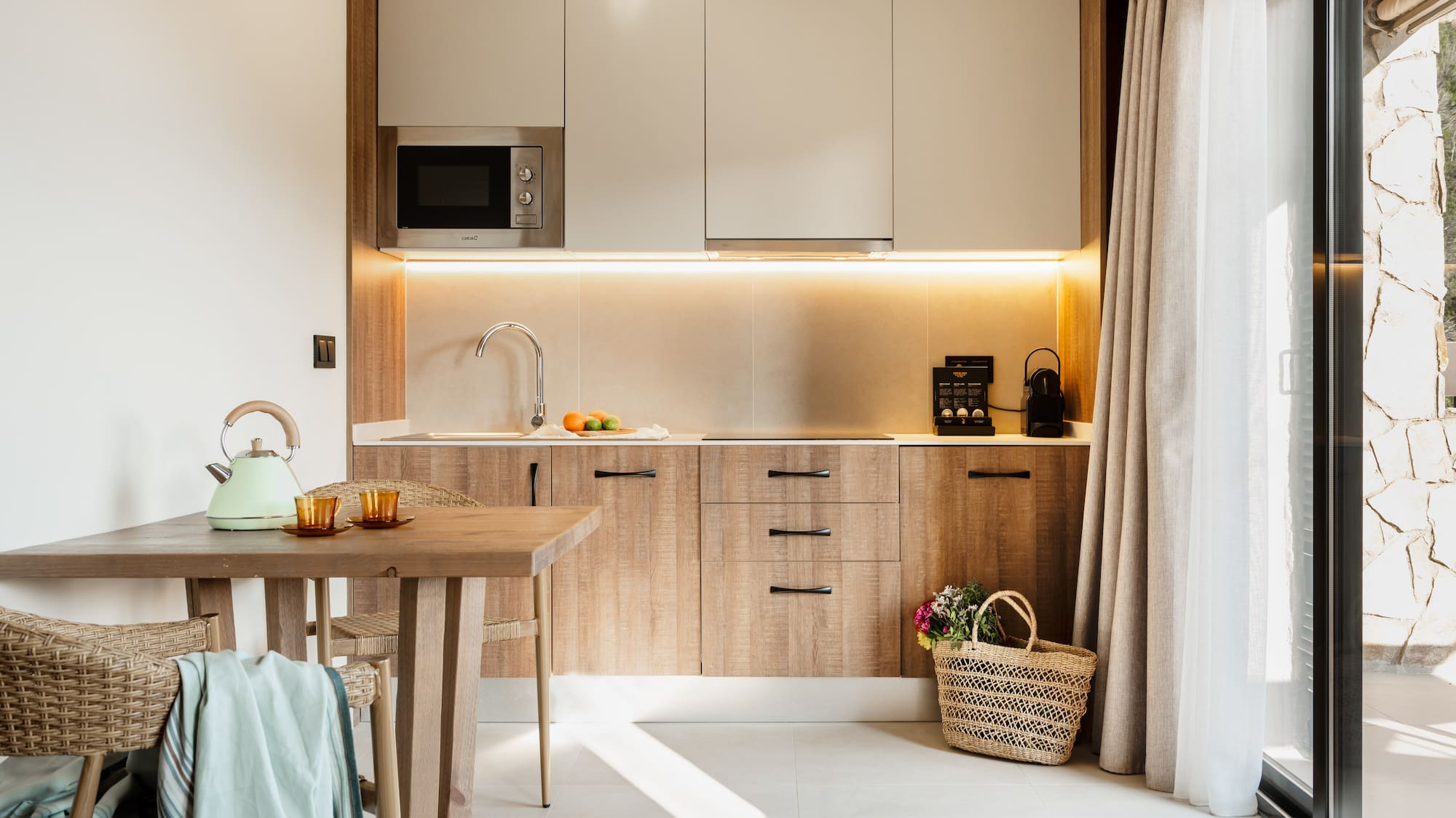 a kitchen with a table and a basket.