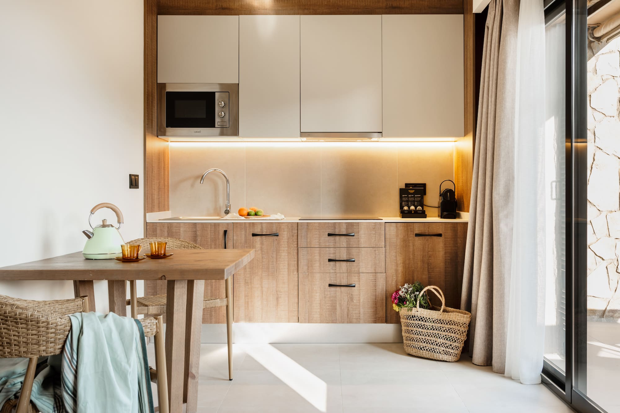 a kitchen with a table and a basket.
