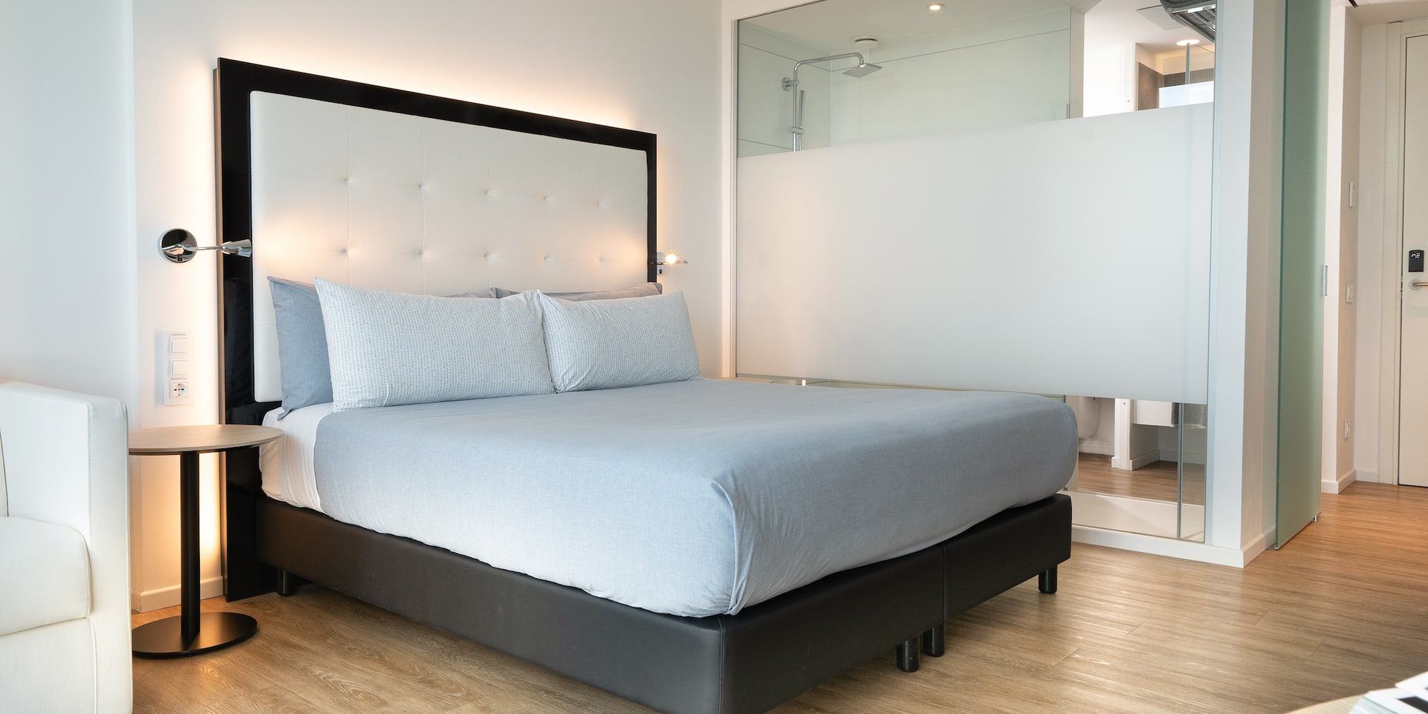 a bed with a large mirror