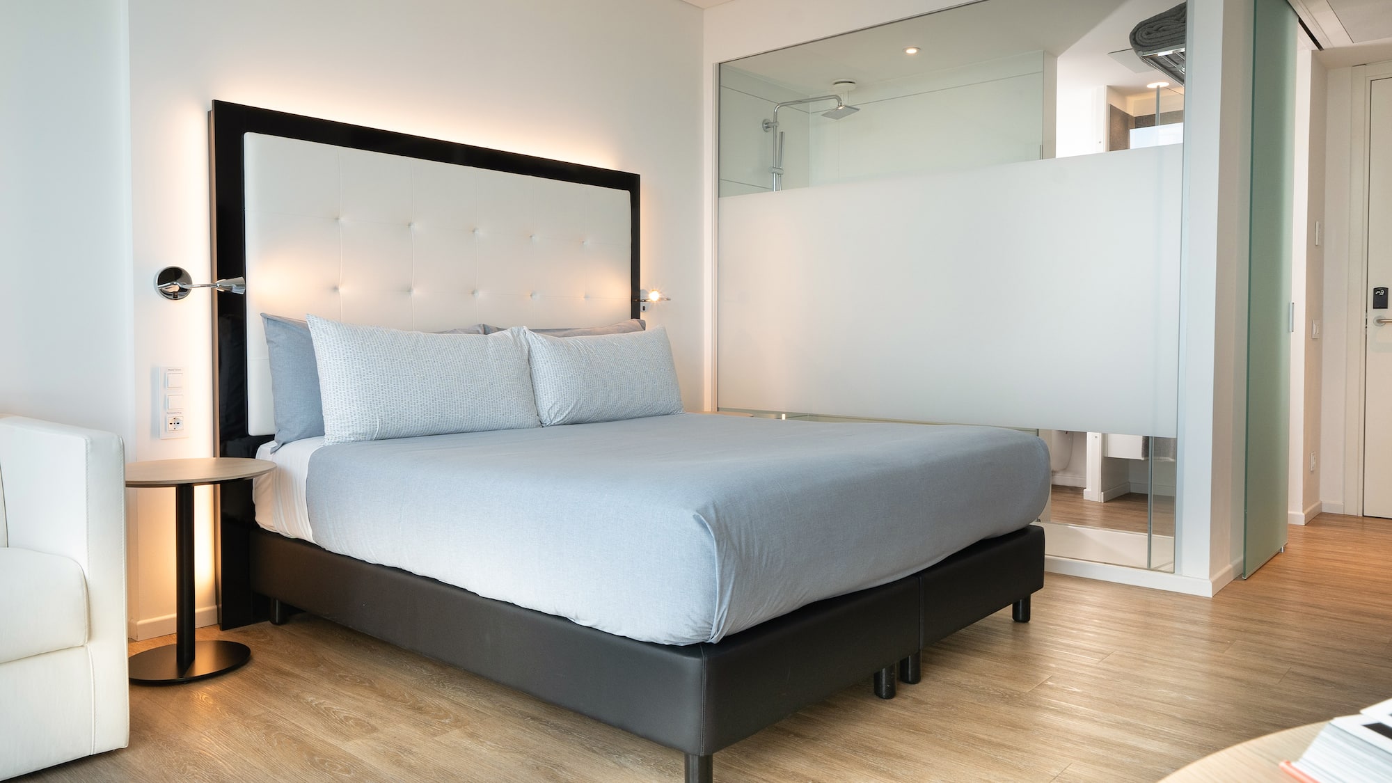 a bed with a large mirror