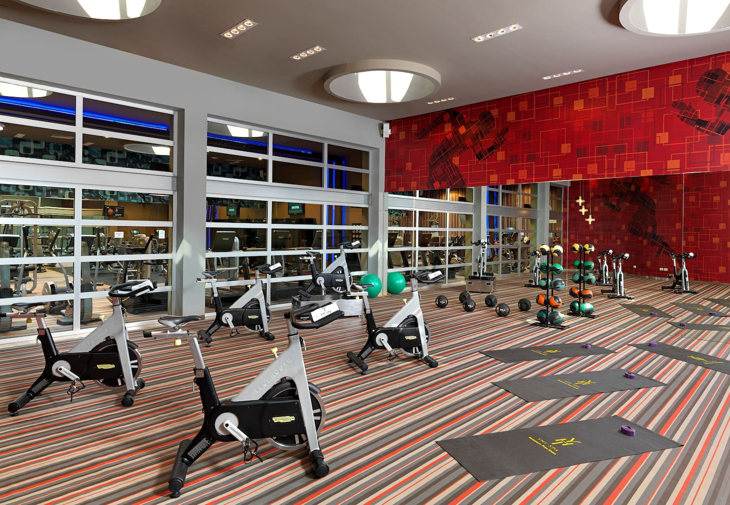 a room with exercise bikes and exercise equipment