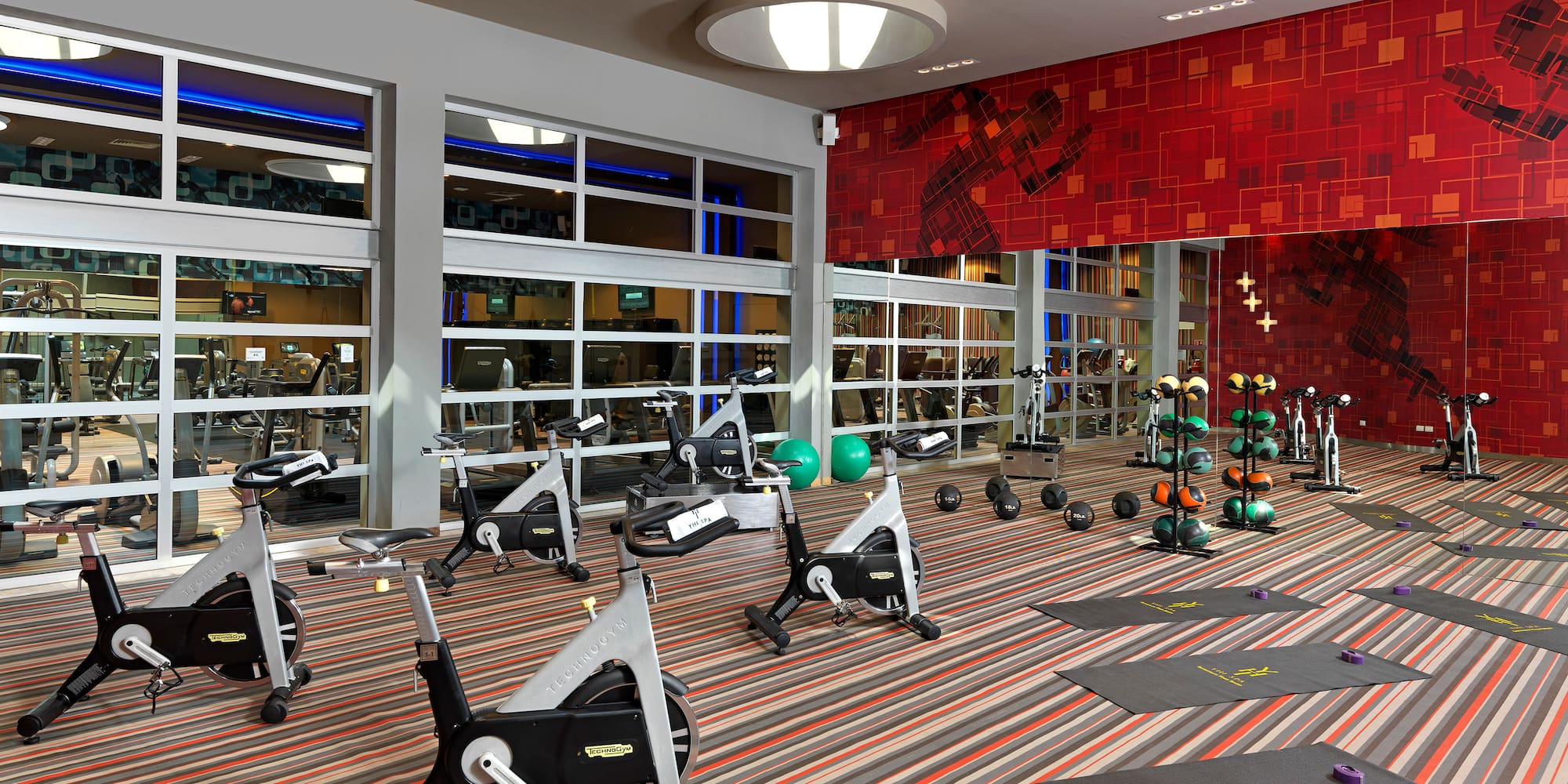 a room with exercise bikes and exercise equipment