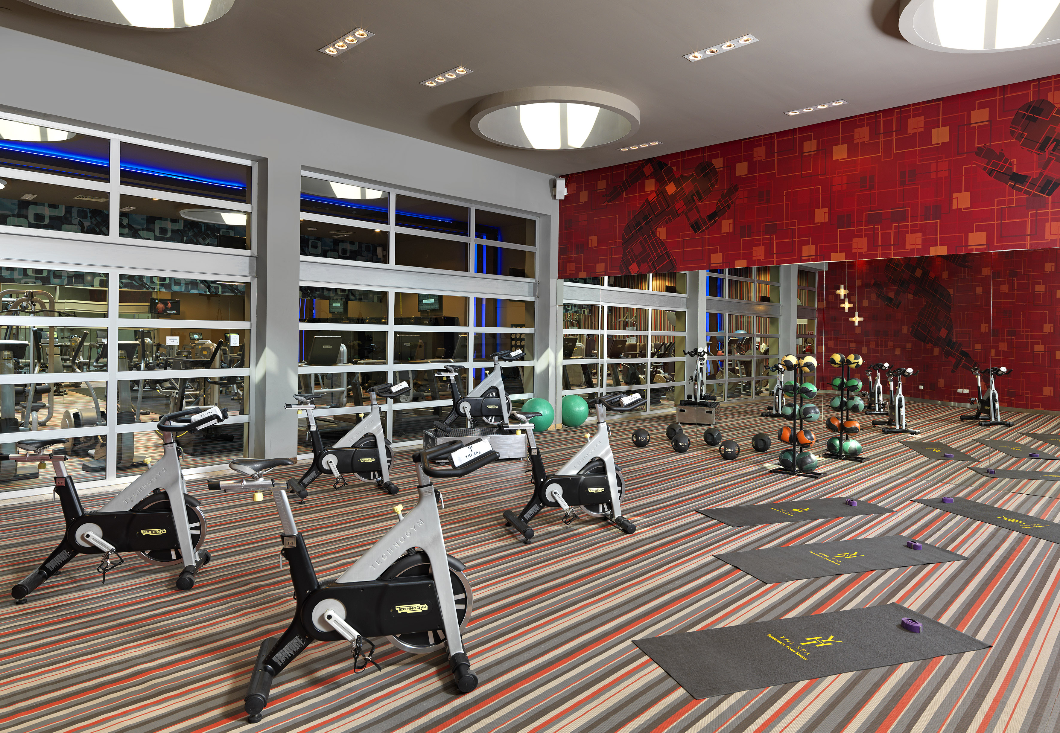 a room with exercise bikes and exercise equipment
