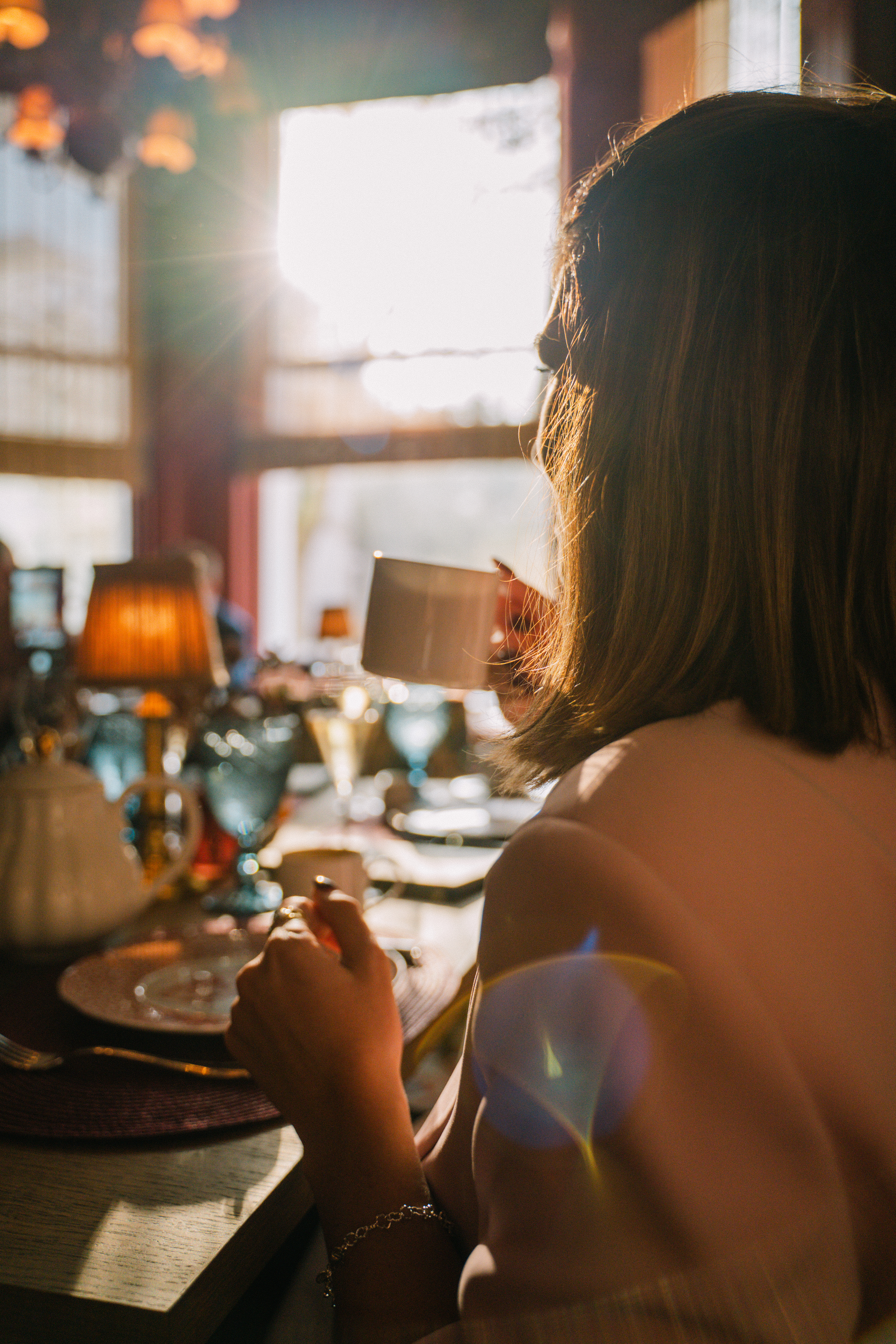 a woman holding a cup of coffee