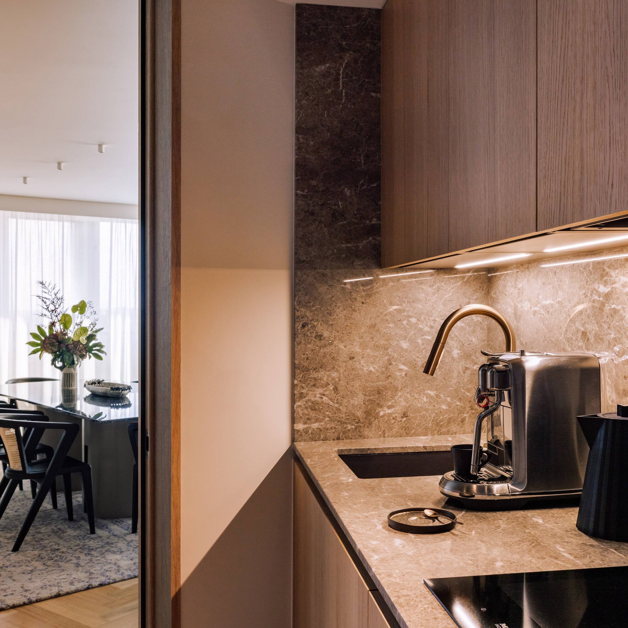 a kitchen with a coffee maker and a table