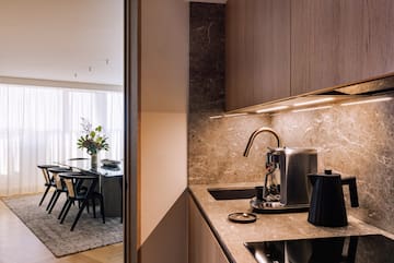 a kitchen with a coffee maker and a table