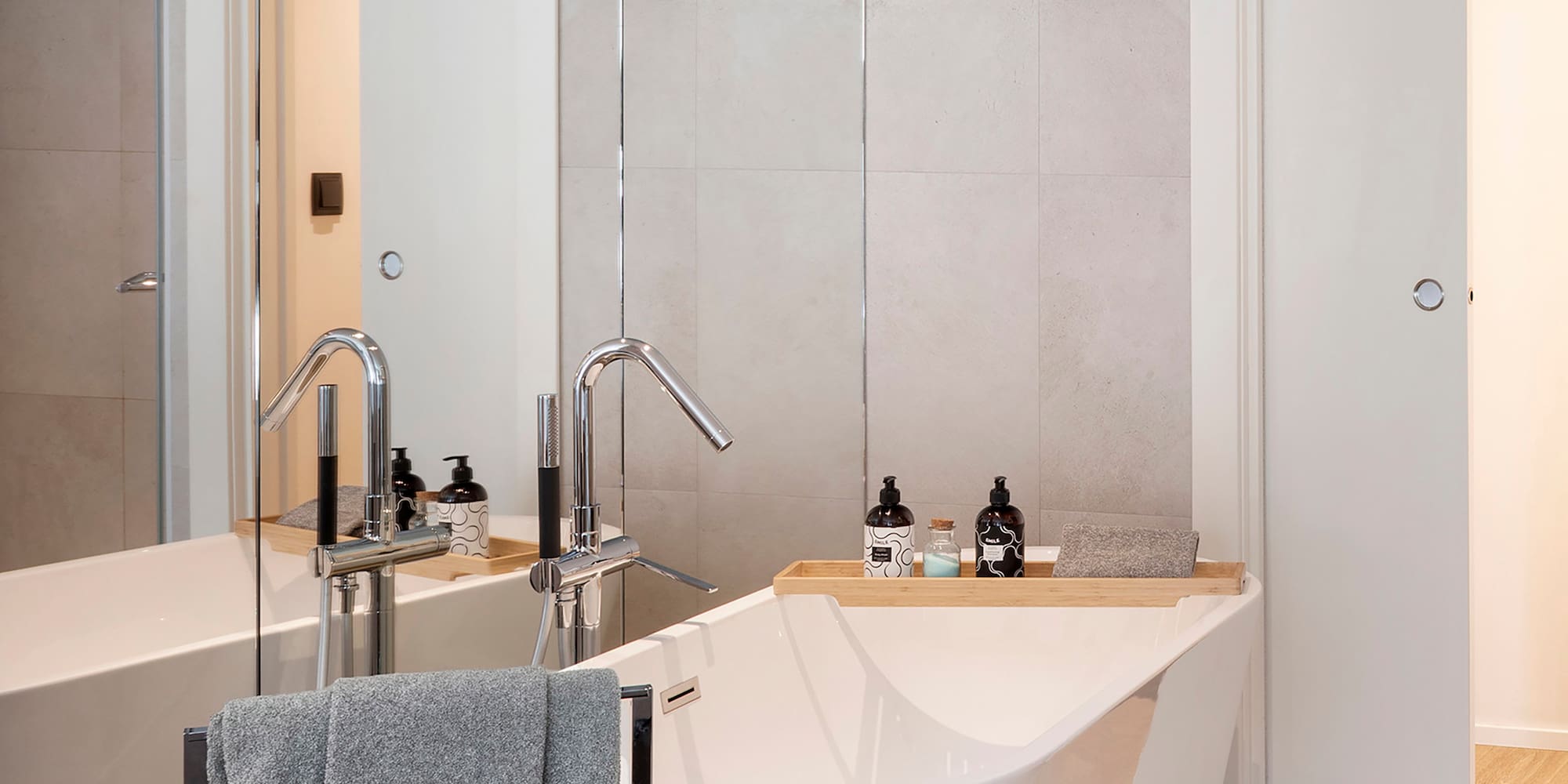 a bathroom with a bathtub and a shower