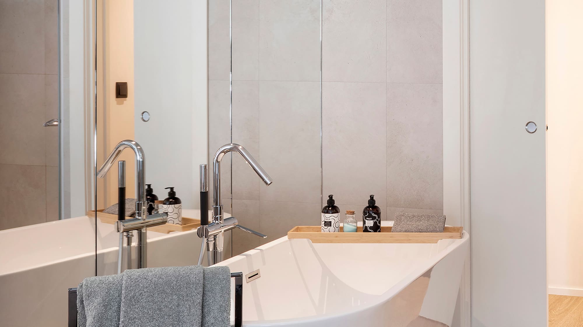 a bathroom with a bathtub and a shower