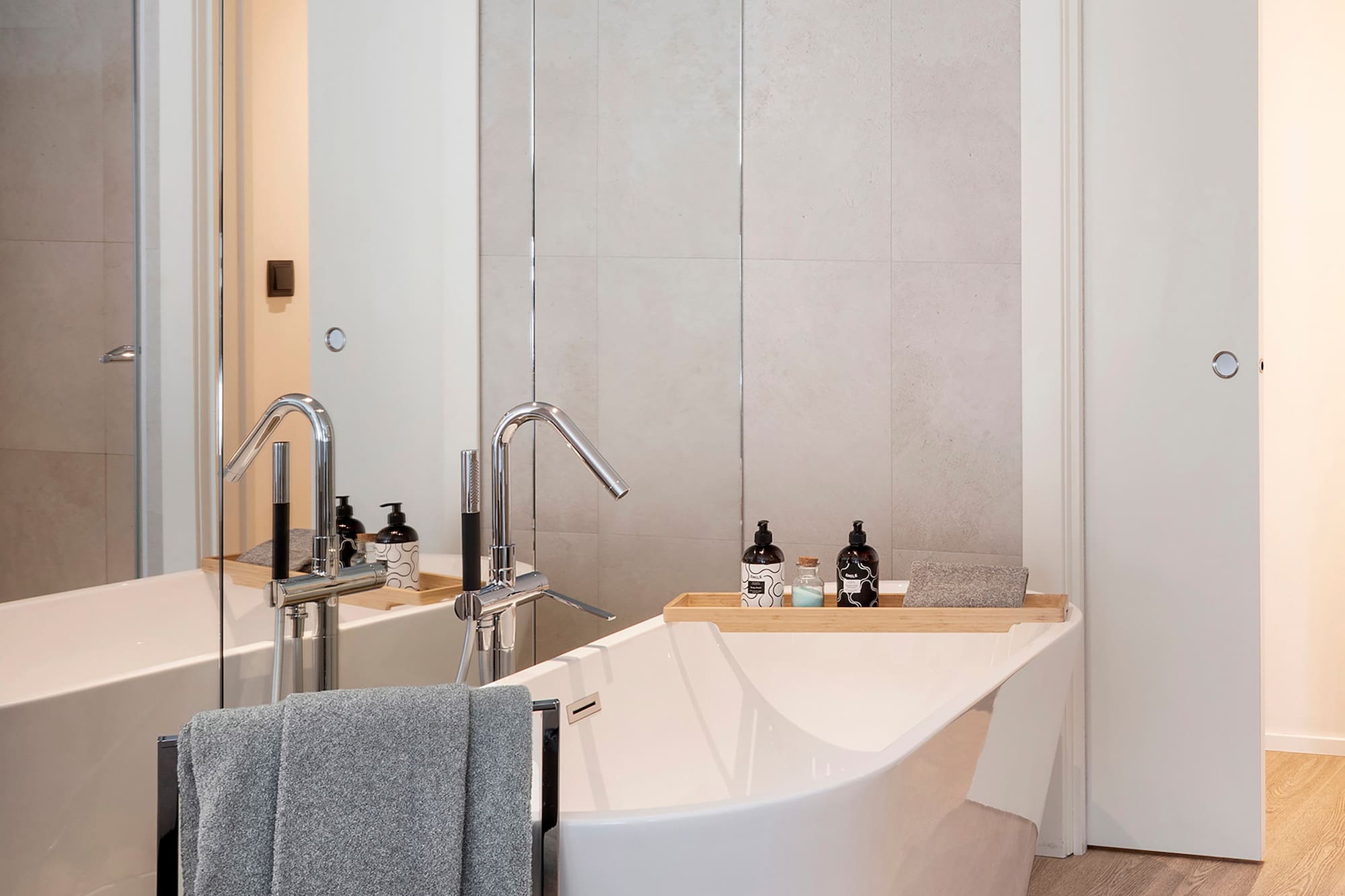 a bathroom with a bathtub and a shower