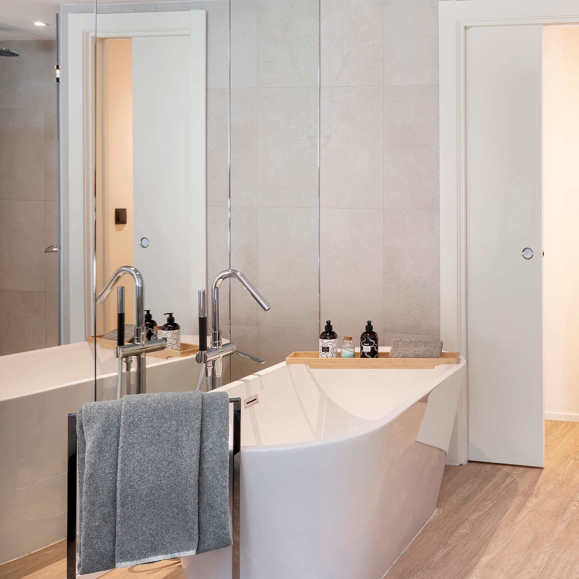 a bathroom with a bathtub and a shower