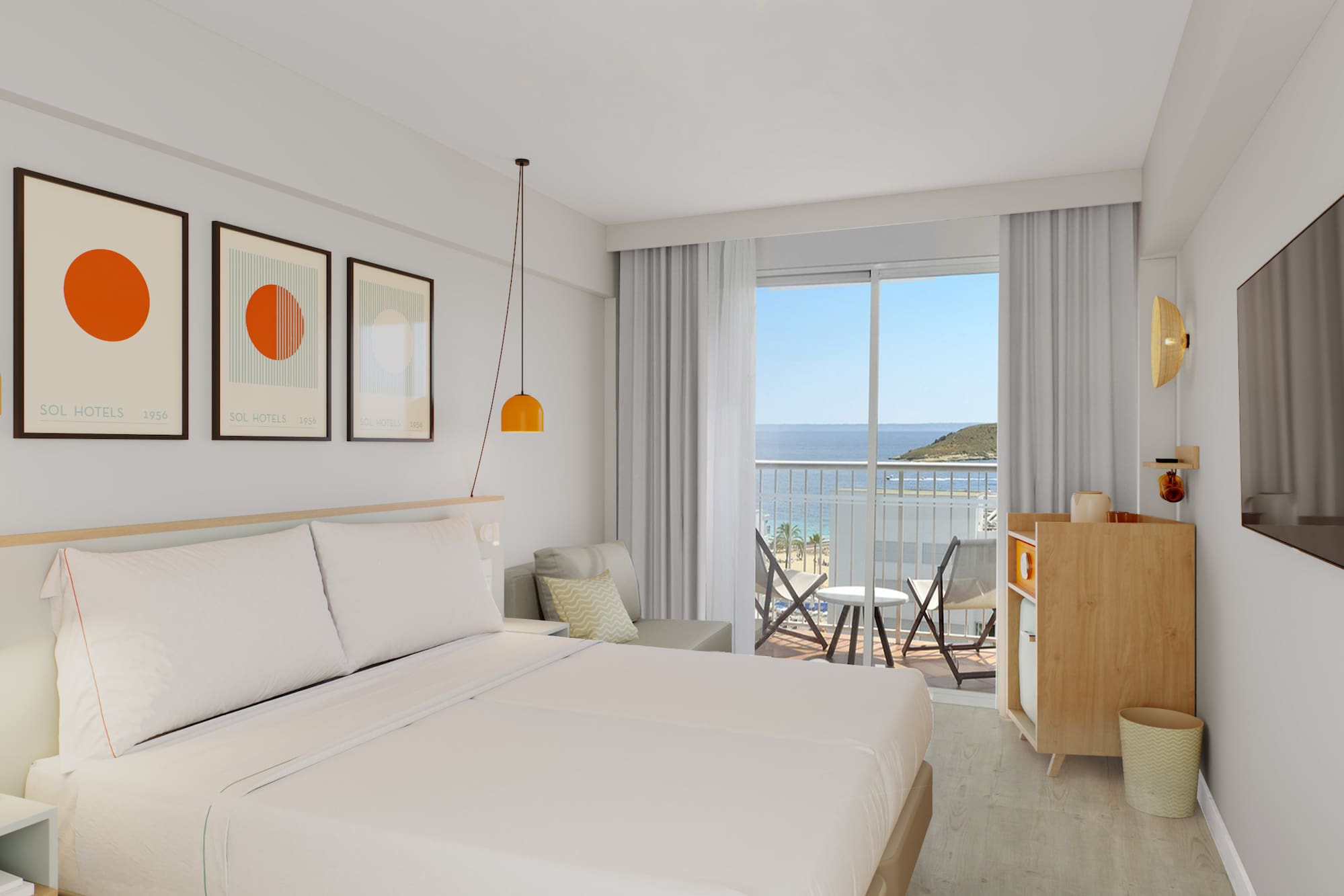 a room with a bed and a balcony overlooking the ocean