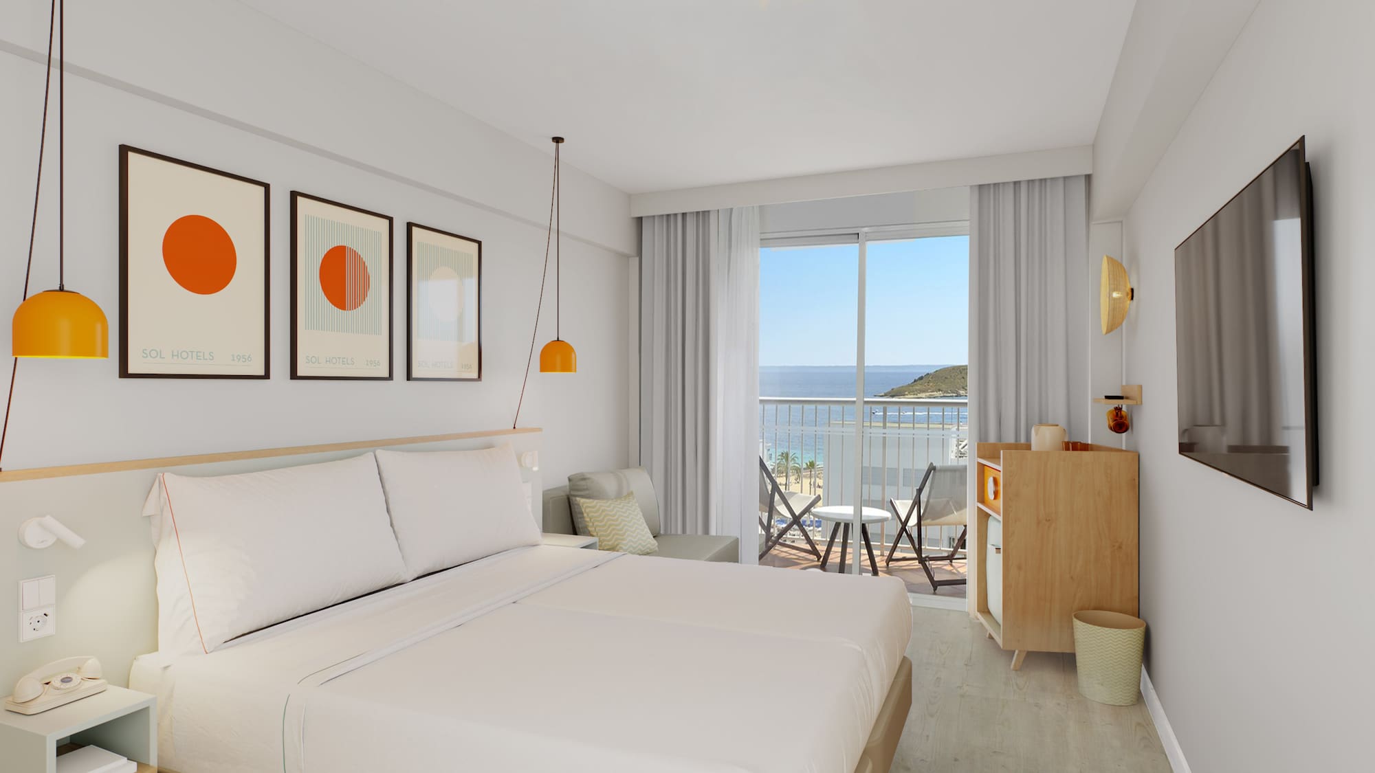 a room with a bed and a balcony overlooking the ocean