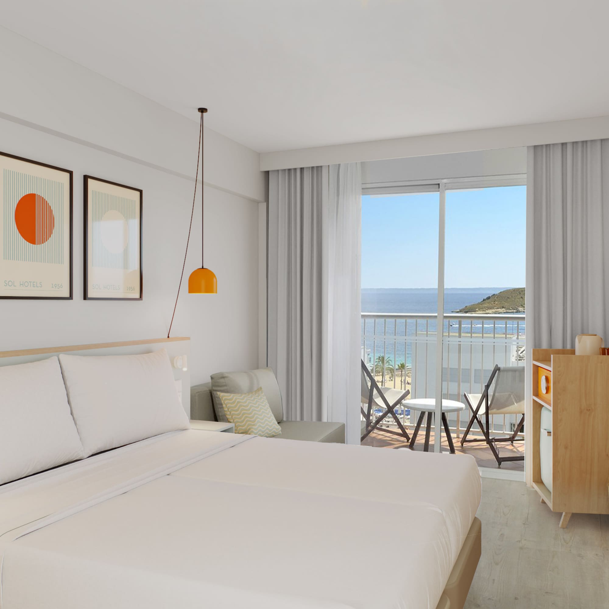 a room with a bed and a balcony overlooking the ocean