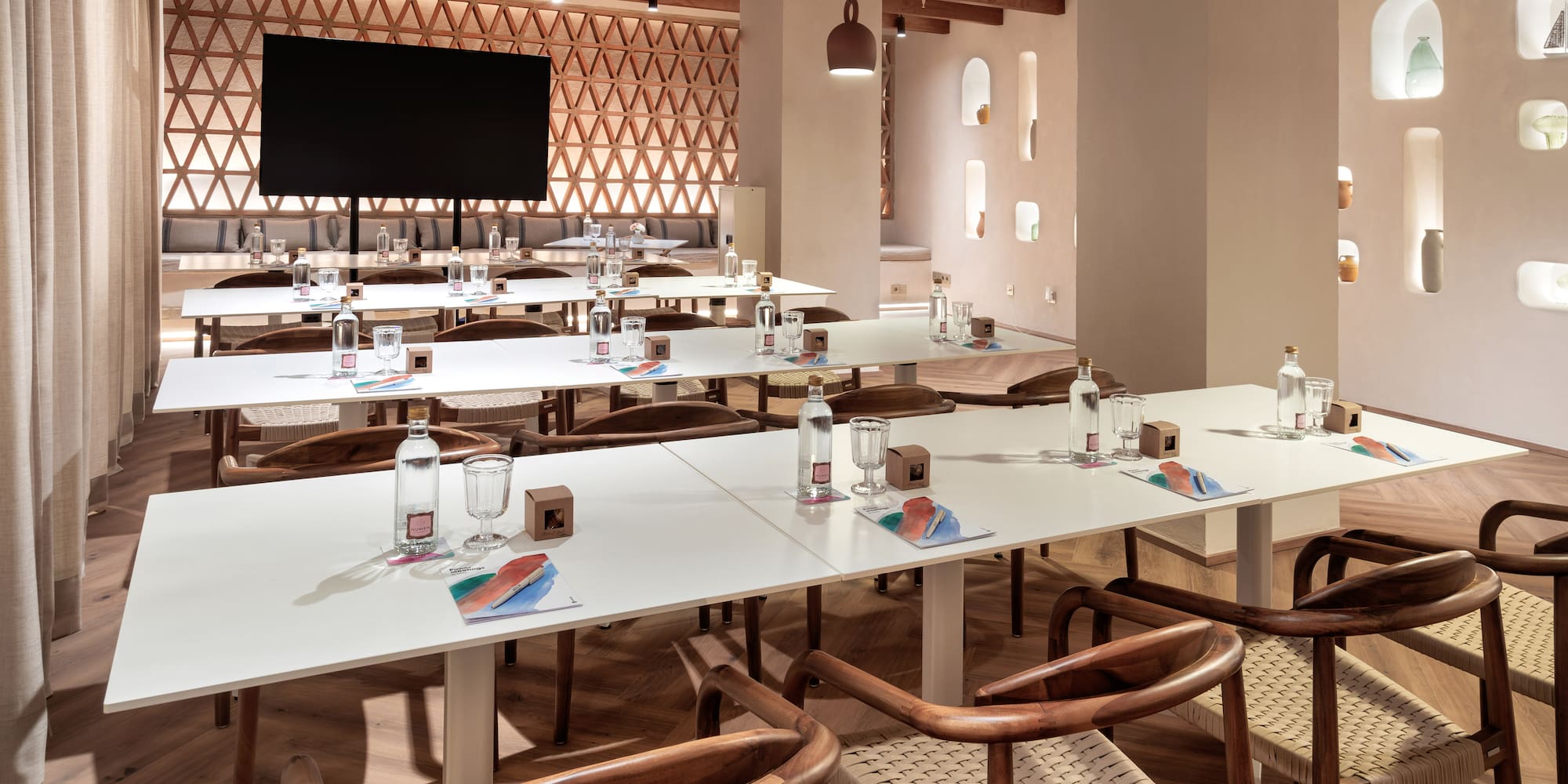 a room with white tables and chairs