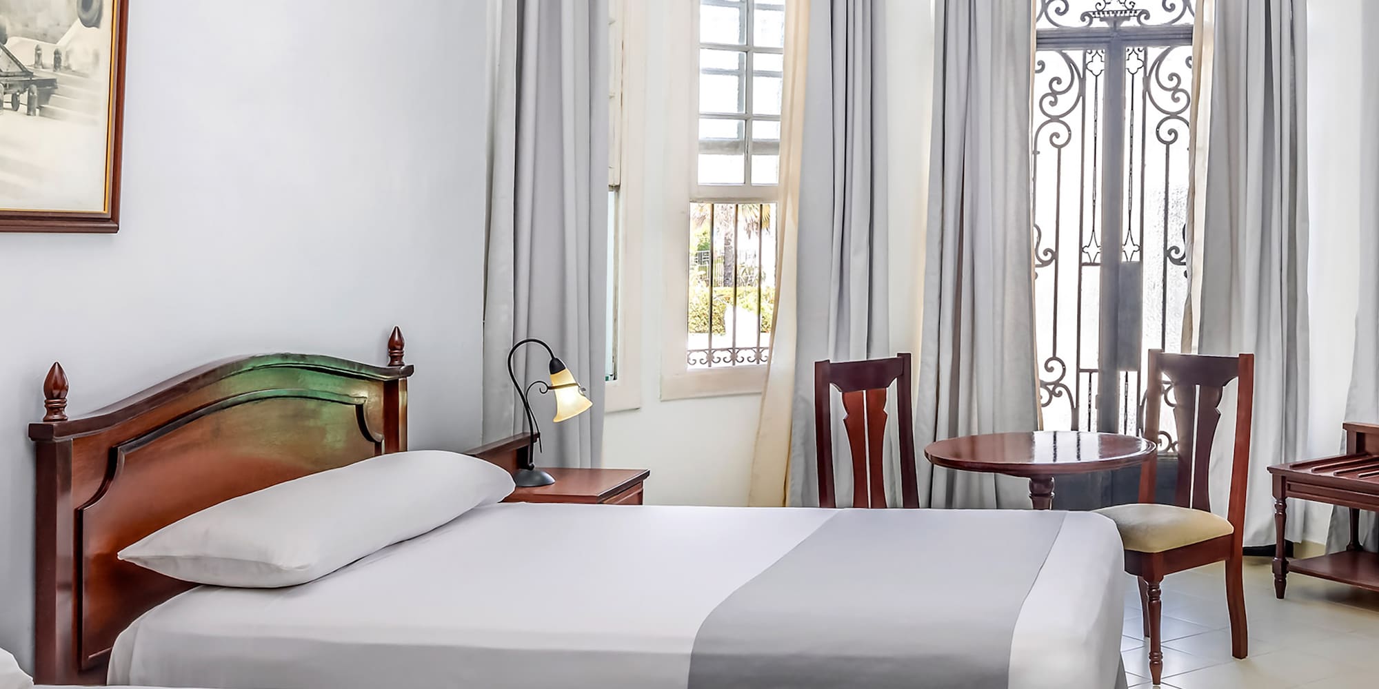 a room with two beds and a door