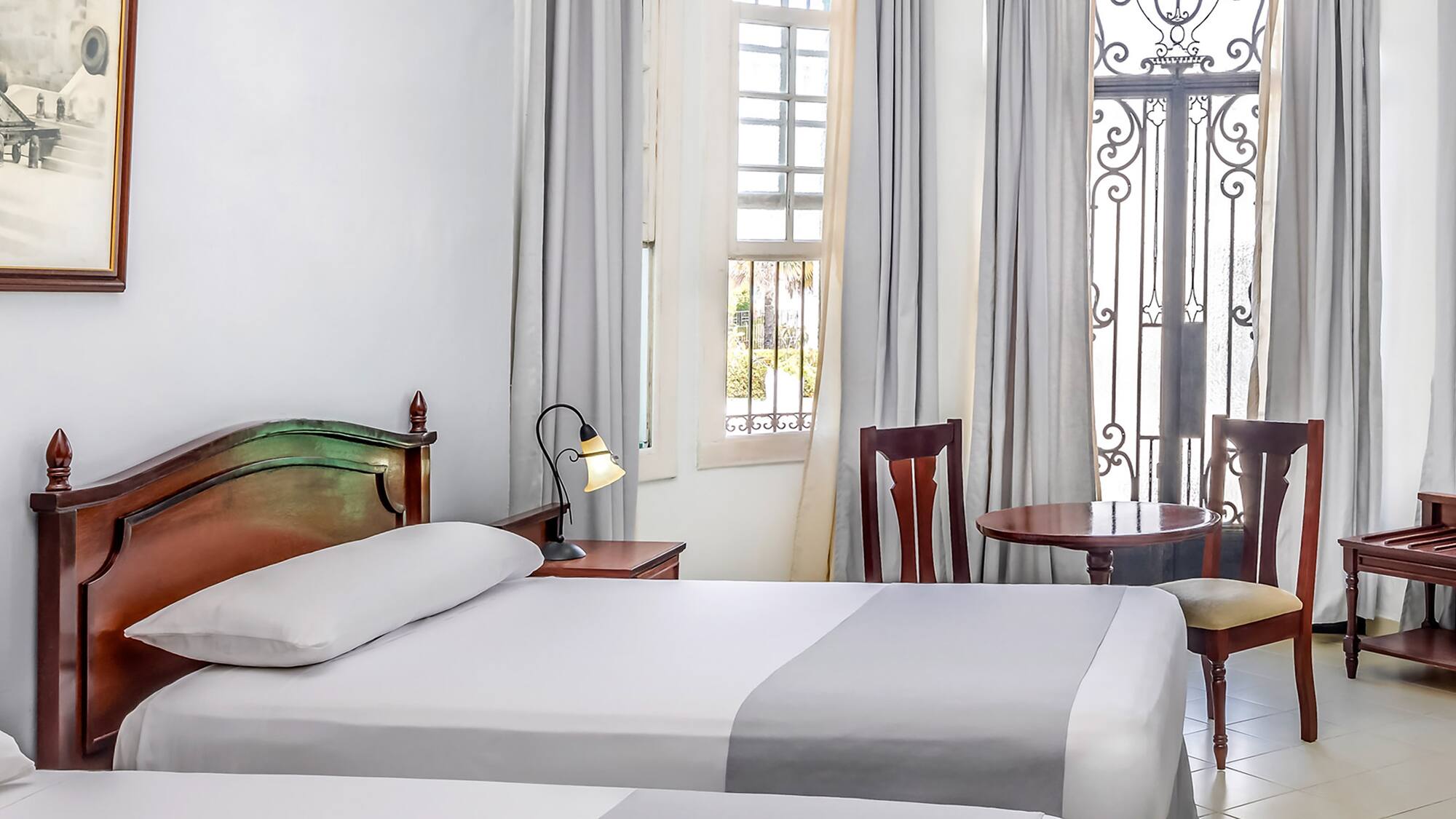 a room with two beds and a door