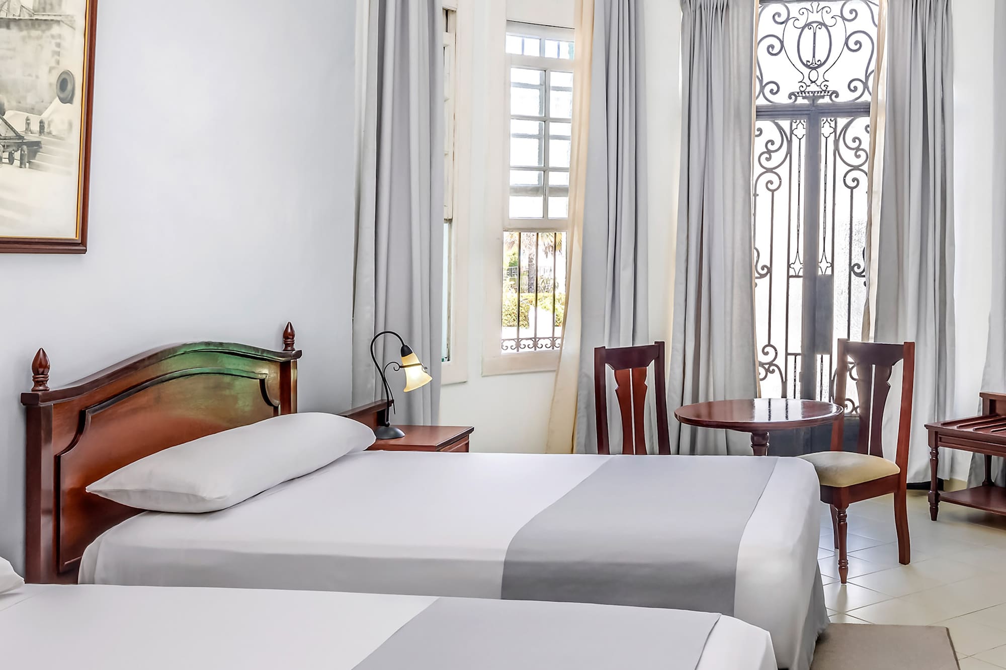 a room with two beds and a door