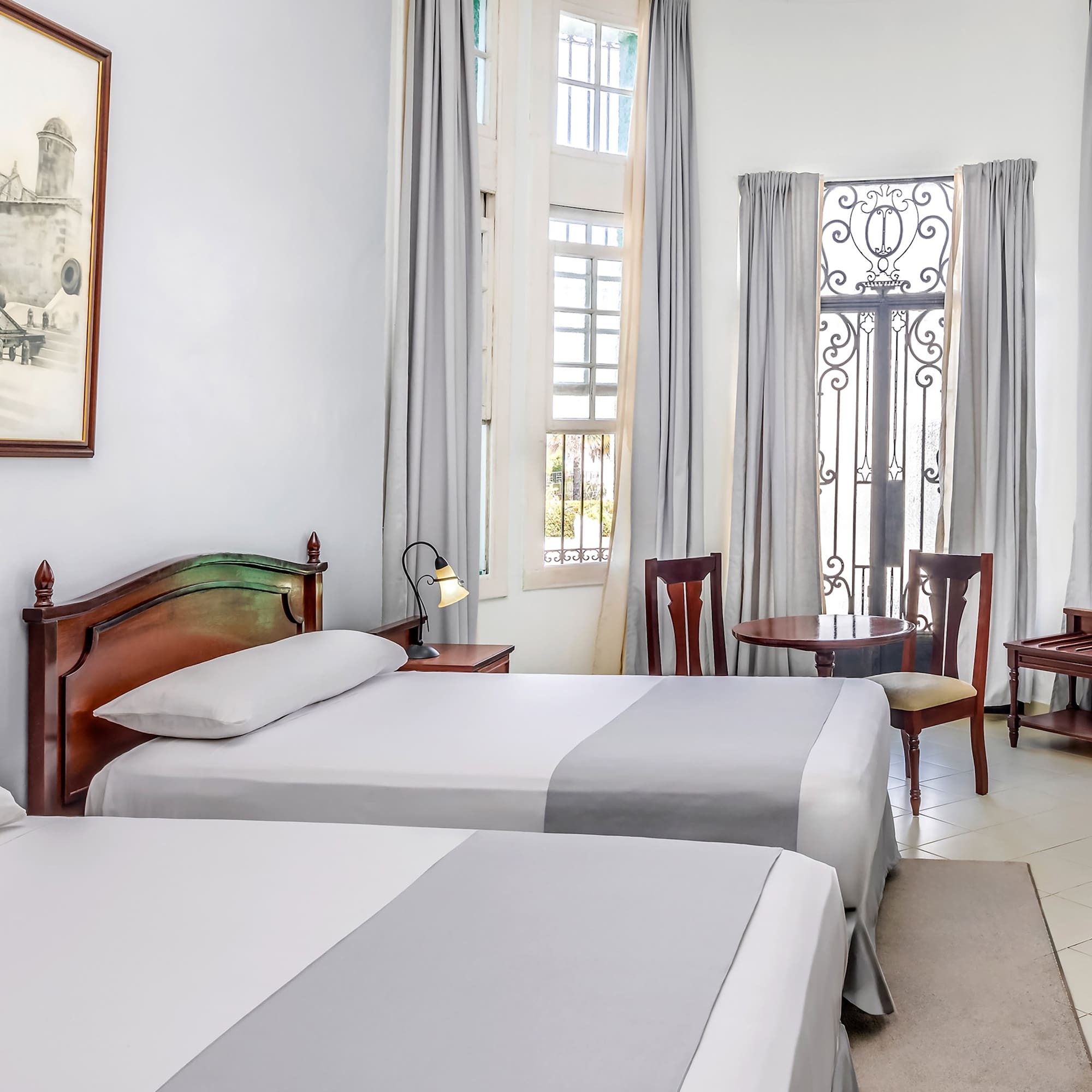 a room with two beds and a door