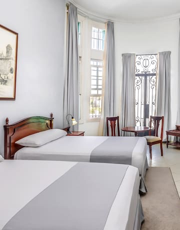 a room with two beds and a door