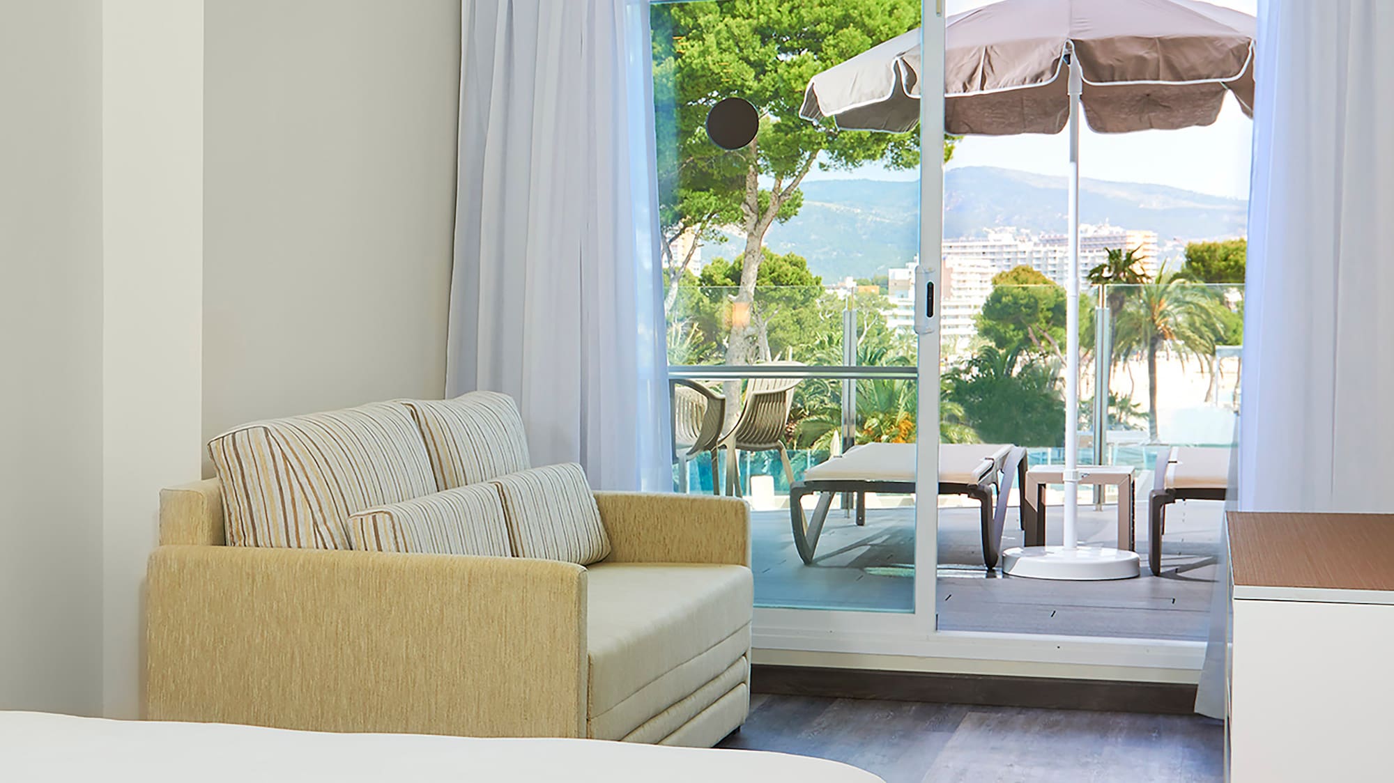 a room with a couch and a sofa