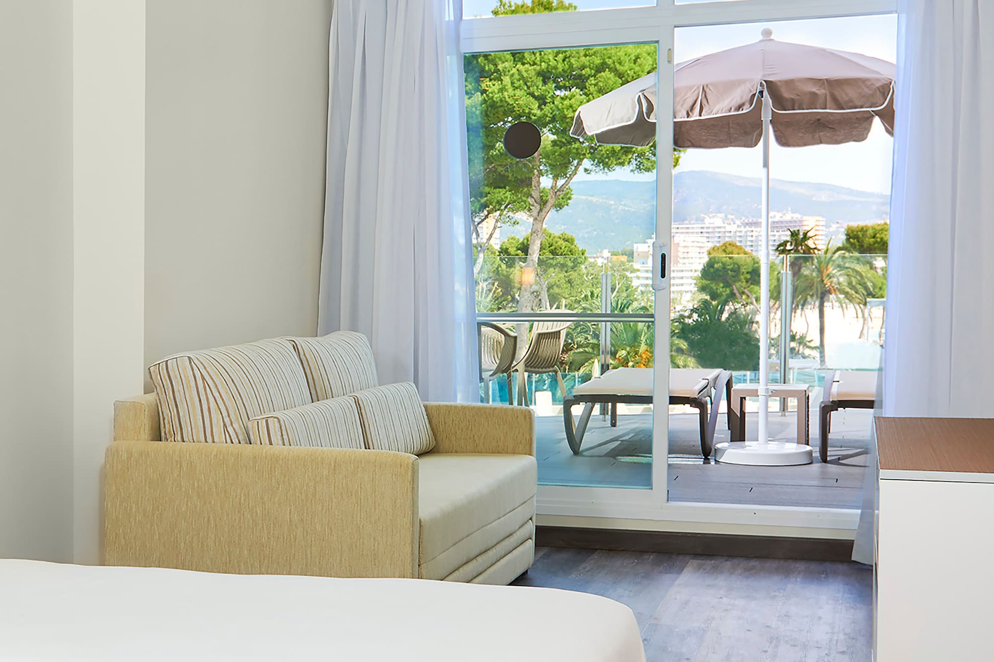 a room with a couch and a sofa