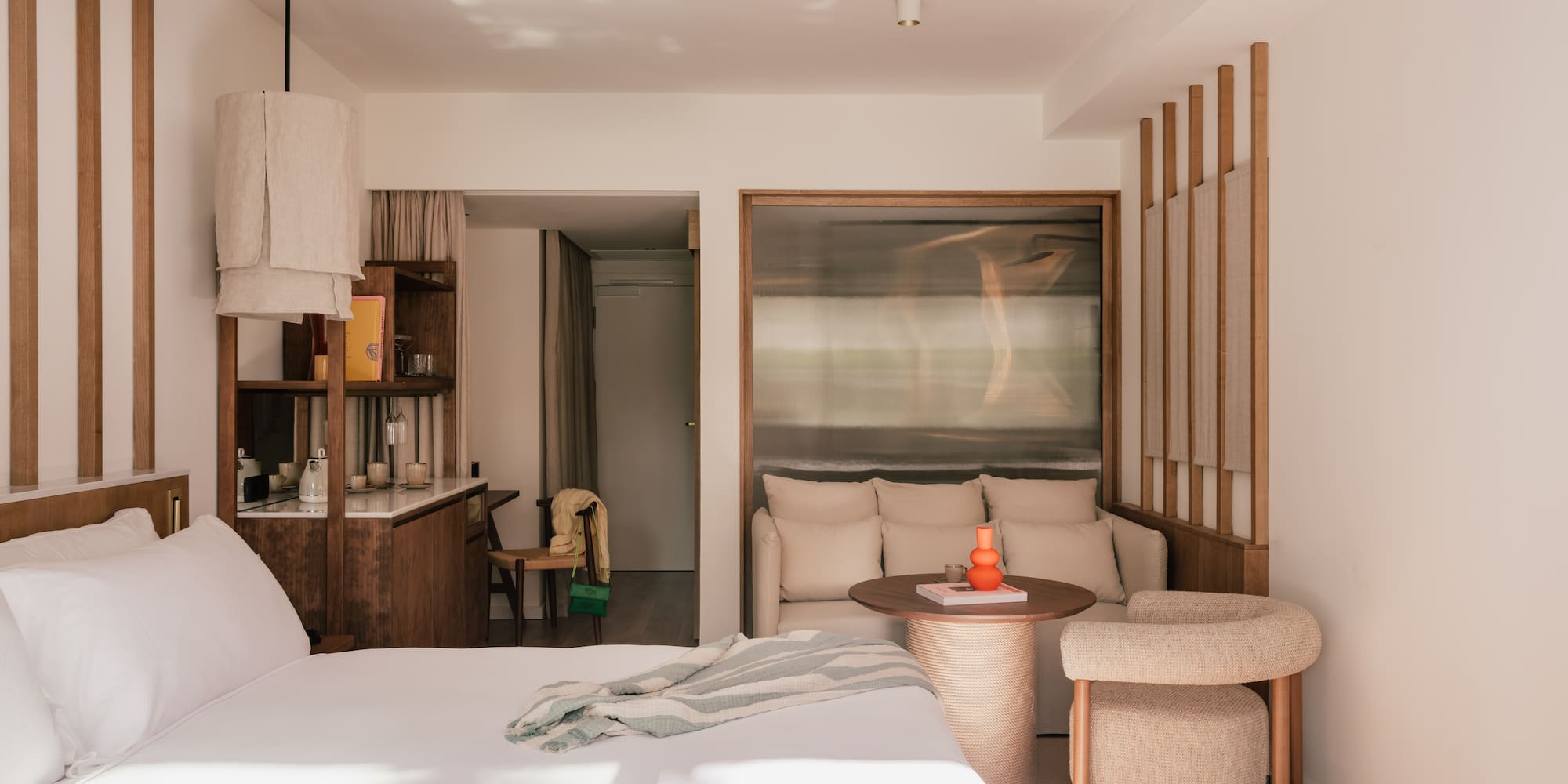 a bedroom with a bed and a table