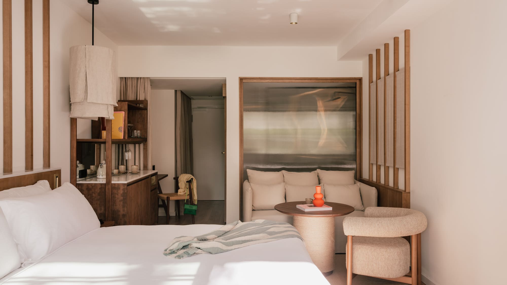 a bedroom with a bed and a table