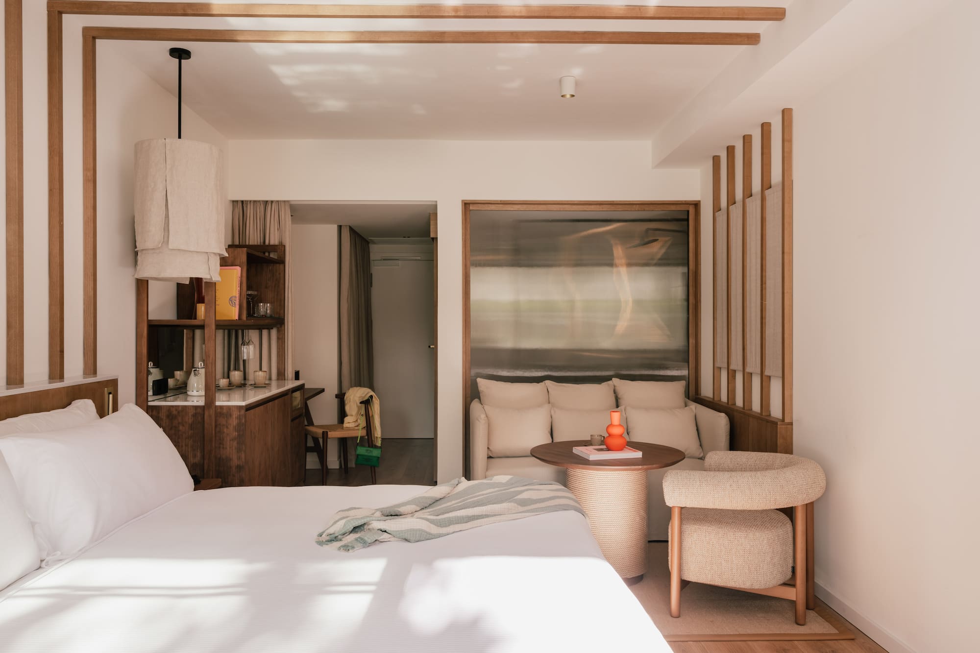 a bedroom with a bed and a table