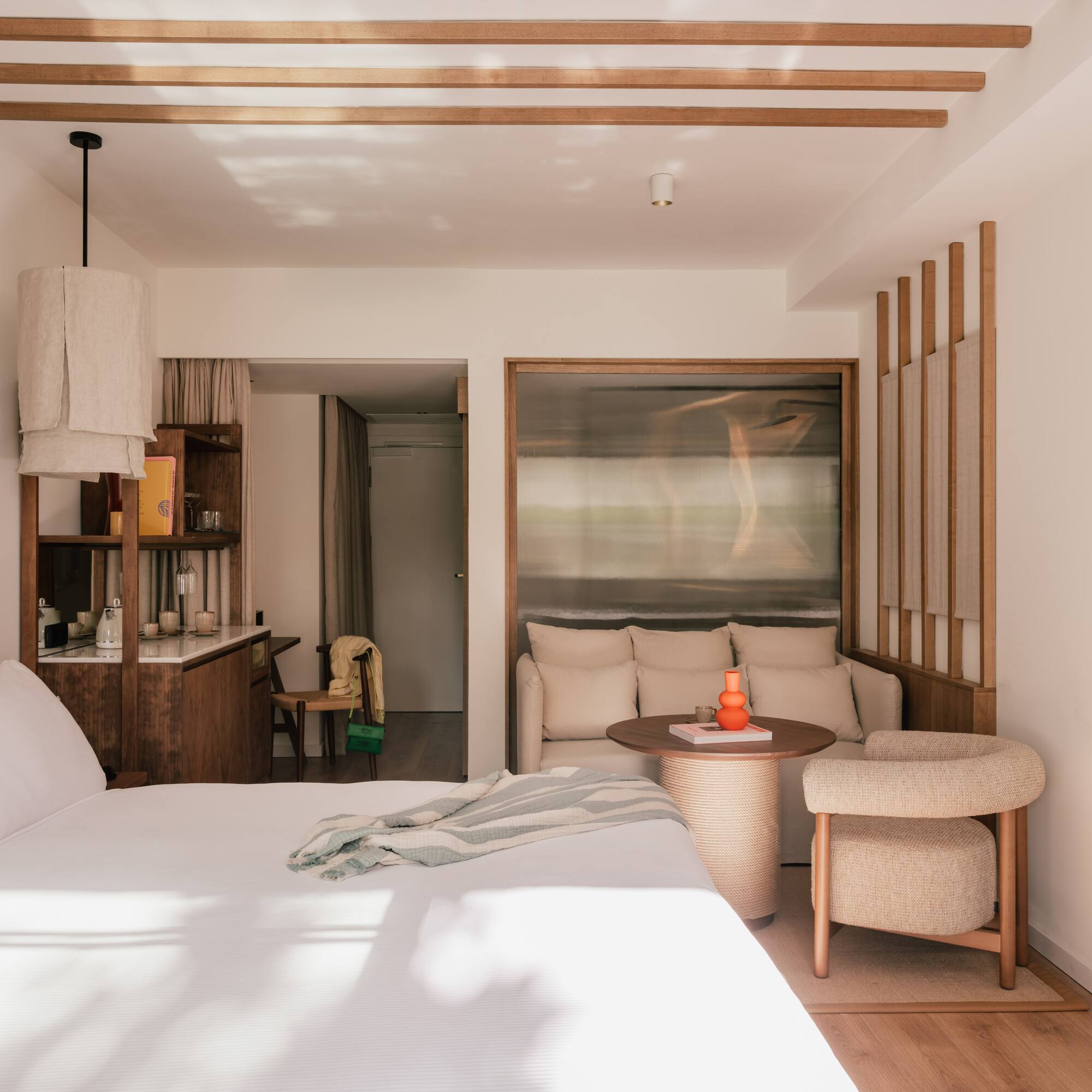 a bedroom with a bed and a table