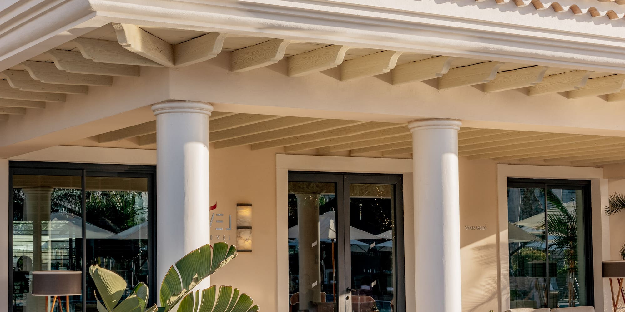 a building with columns and chairs