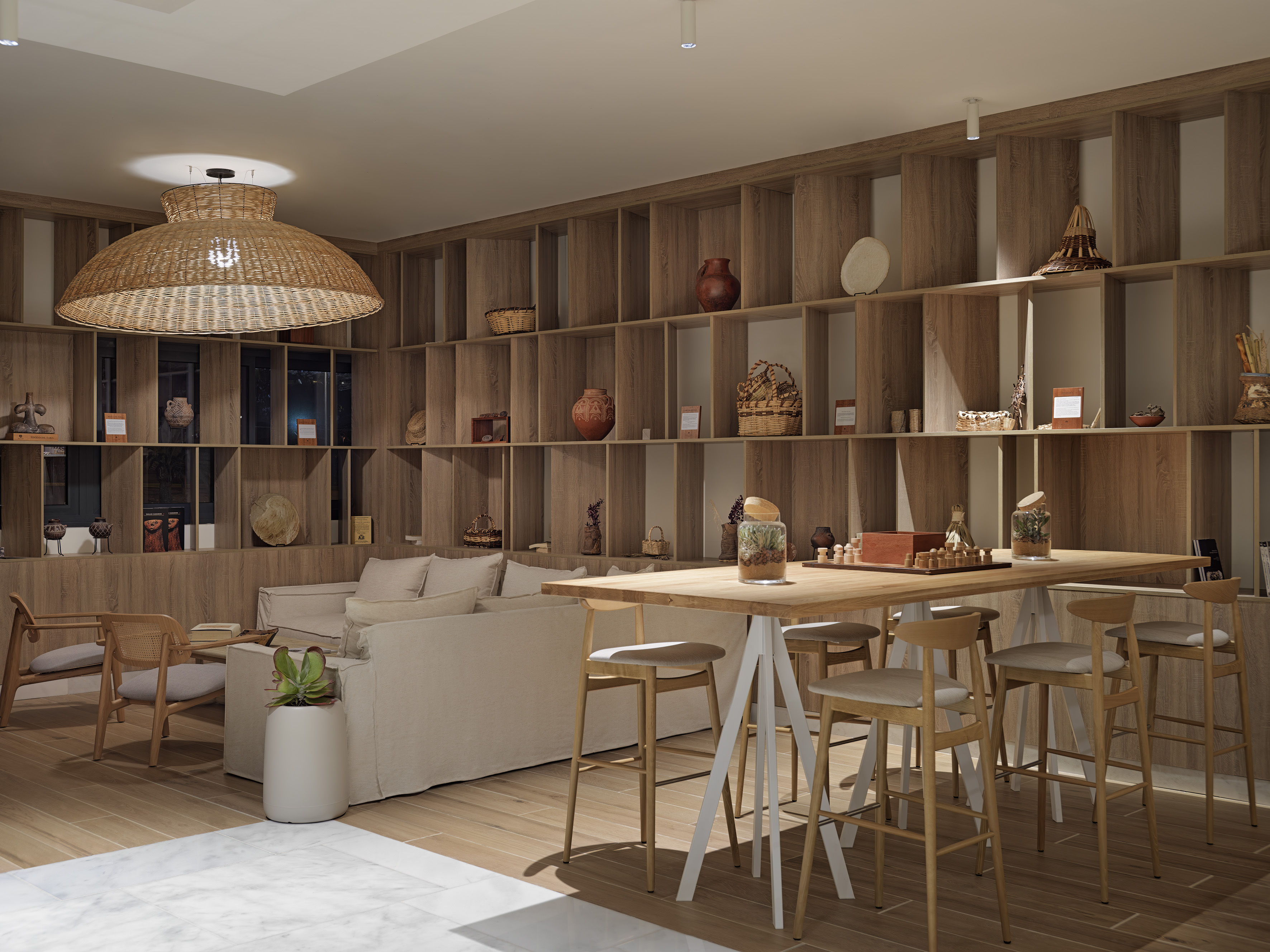 Modern interior with wood shelving, rattan pendant light, lounge, and high table.