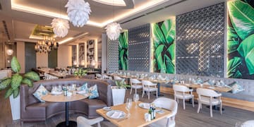 a restaurant with tables and chairs