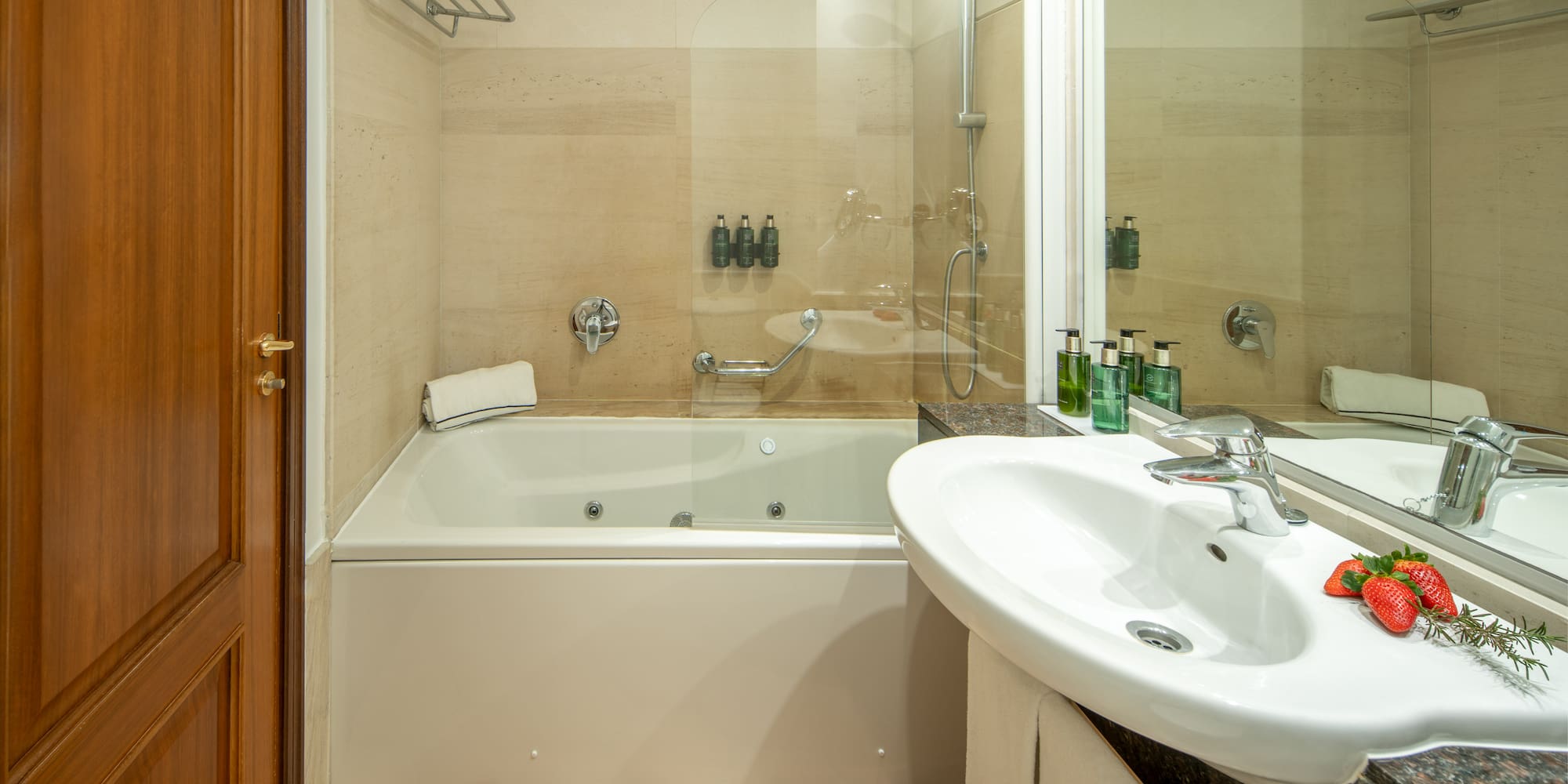 a bathroom with a shower and tub