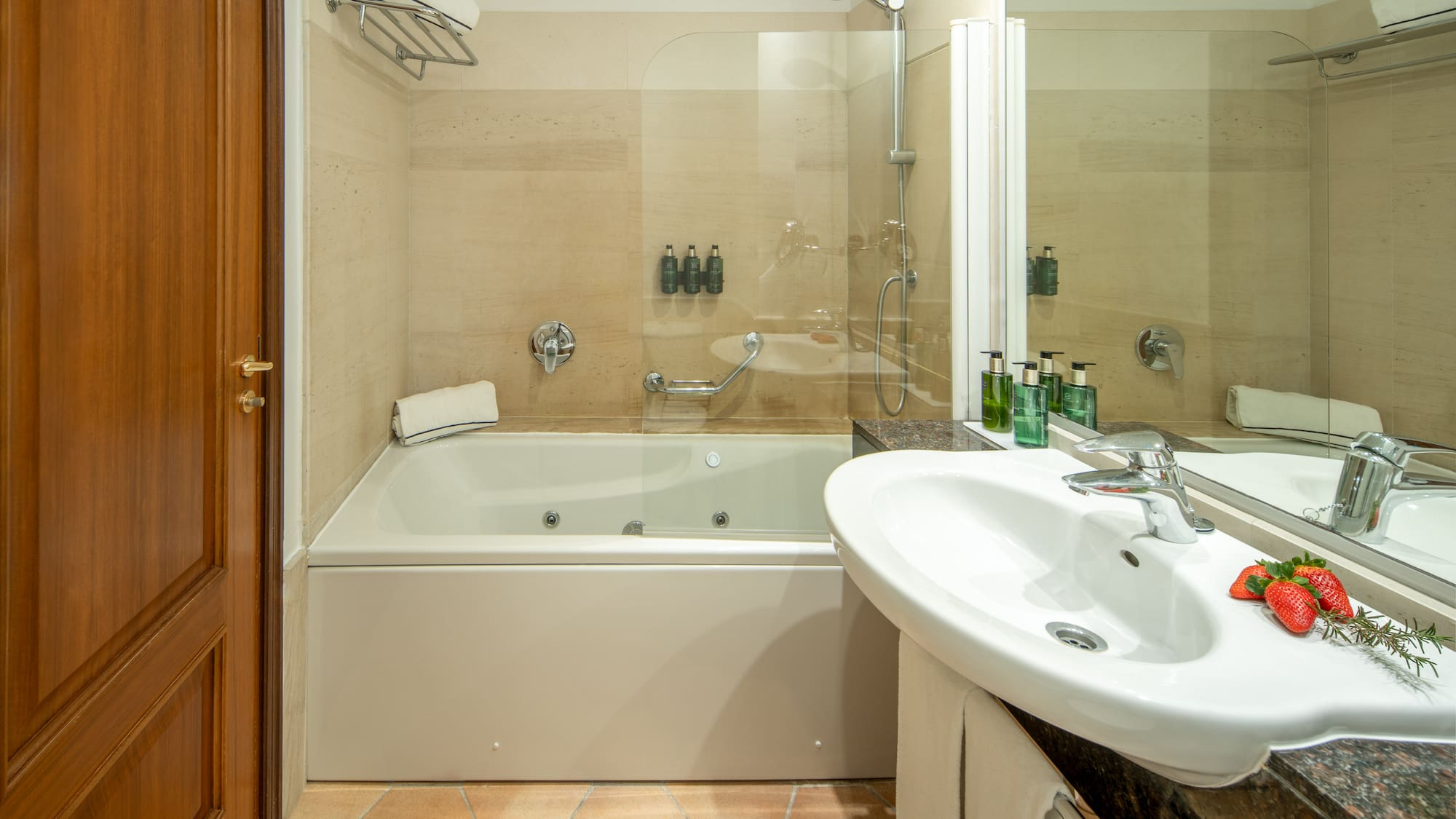 a bathroom with a shower and tub