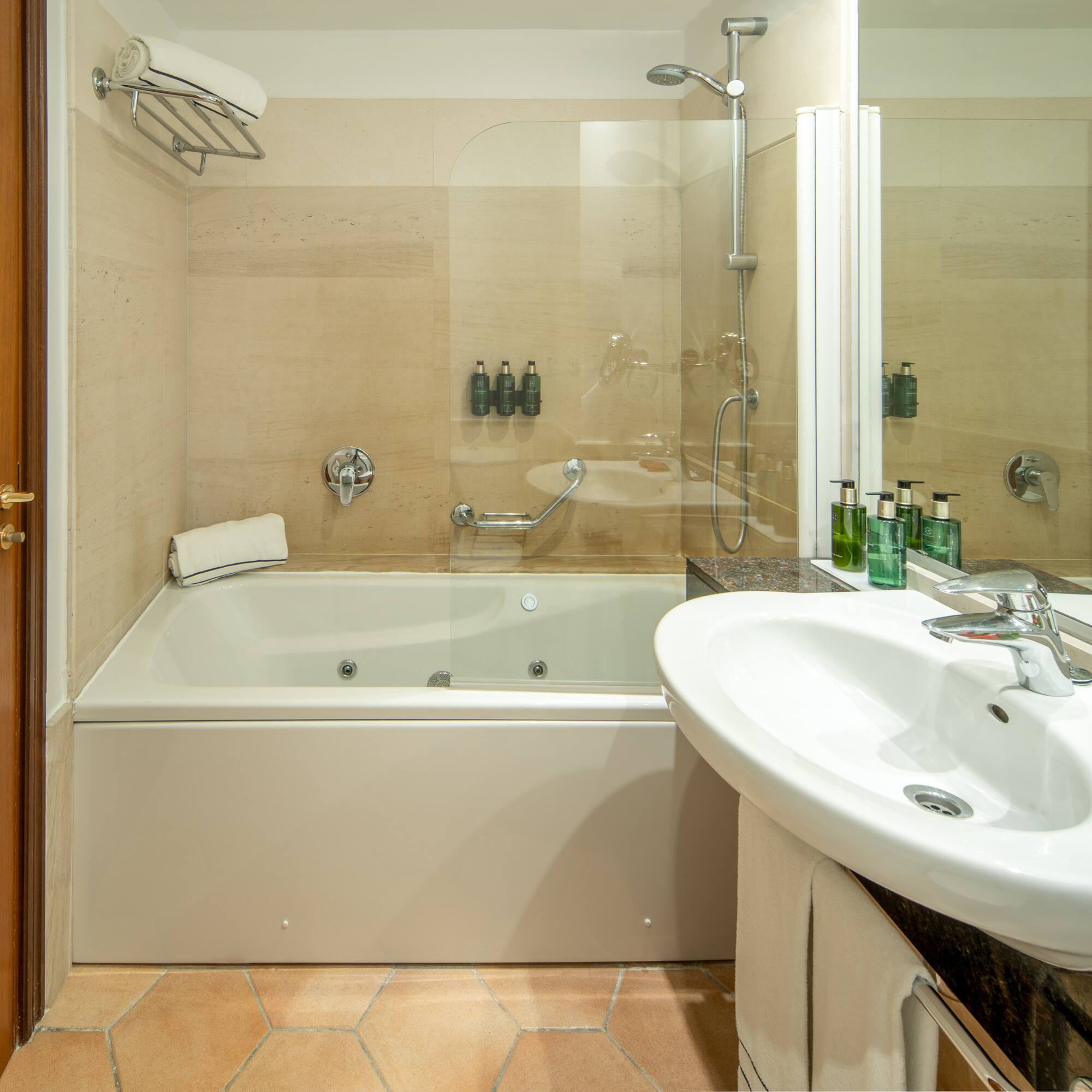 a bathroom with a shower and tub