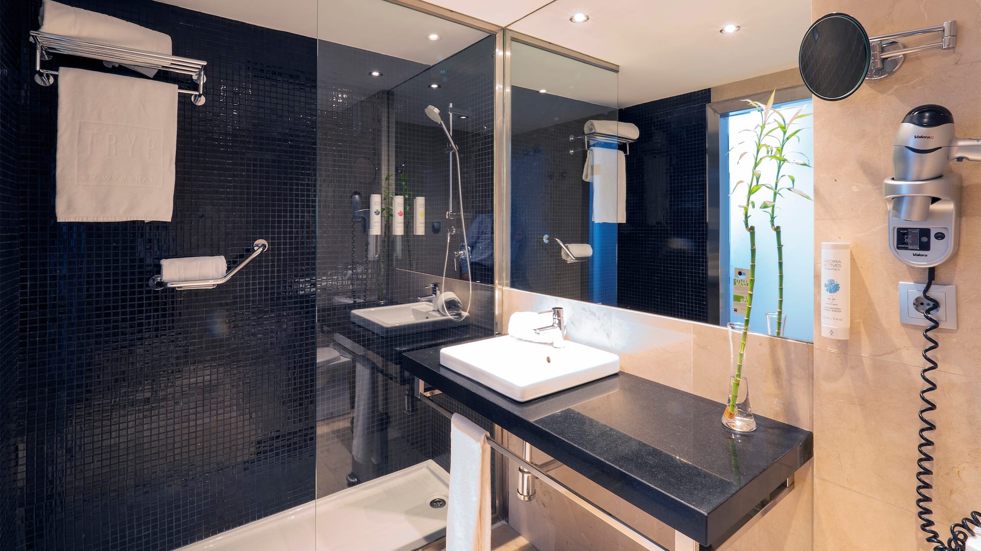 a bathroom with a shower and sink