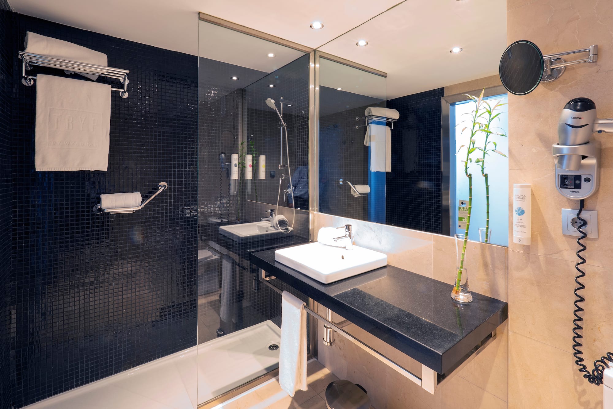 a bathroom with a shower and sink