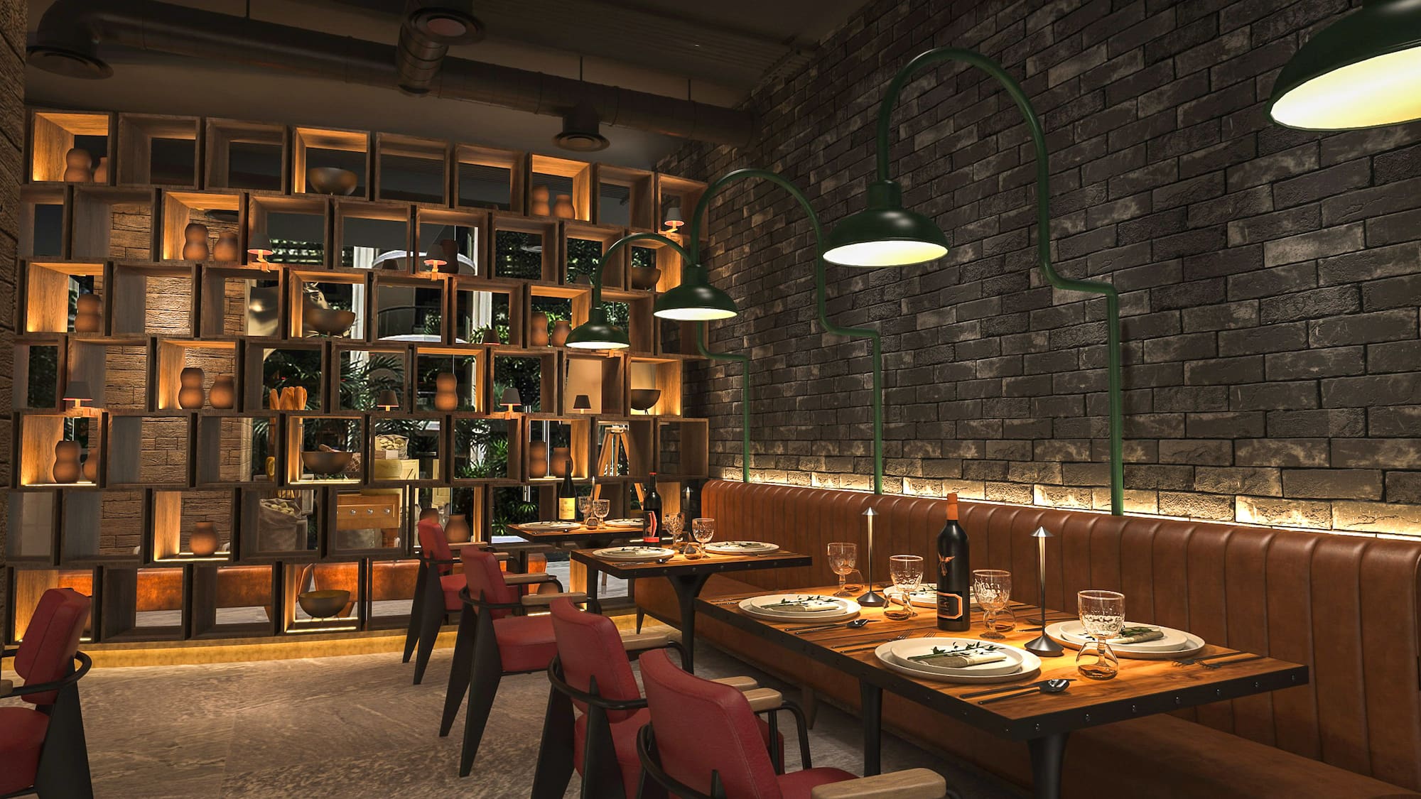a restaurant with a brick wall and a table set with plates and wine glasses