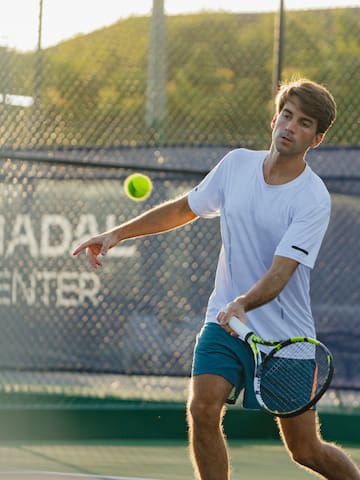a man playing tennis