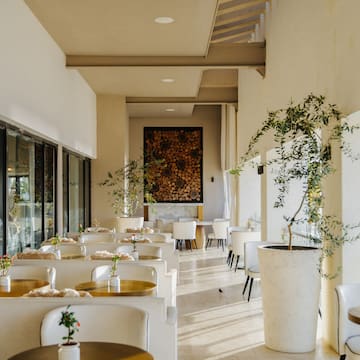 a room with tables and chairs